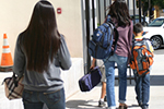 people walking on the sidewalk